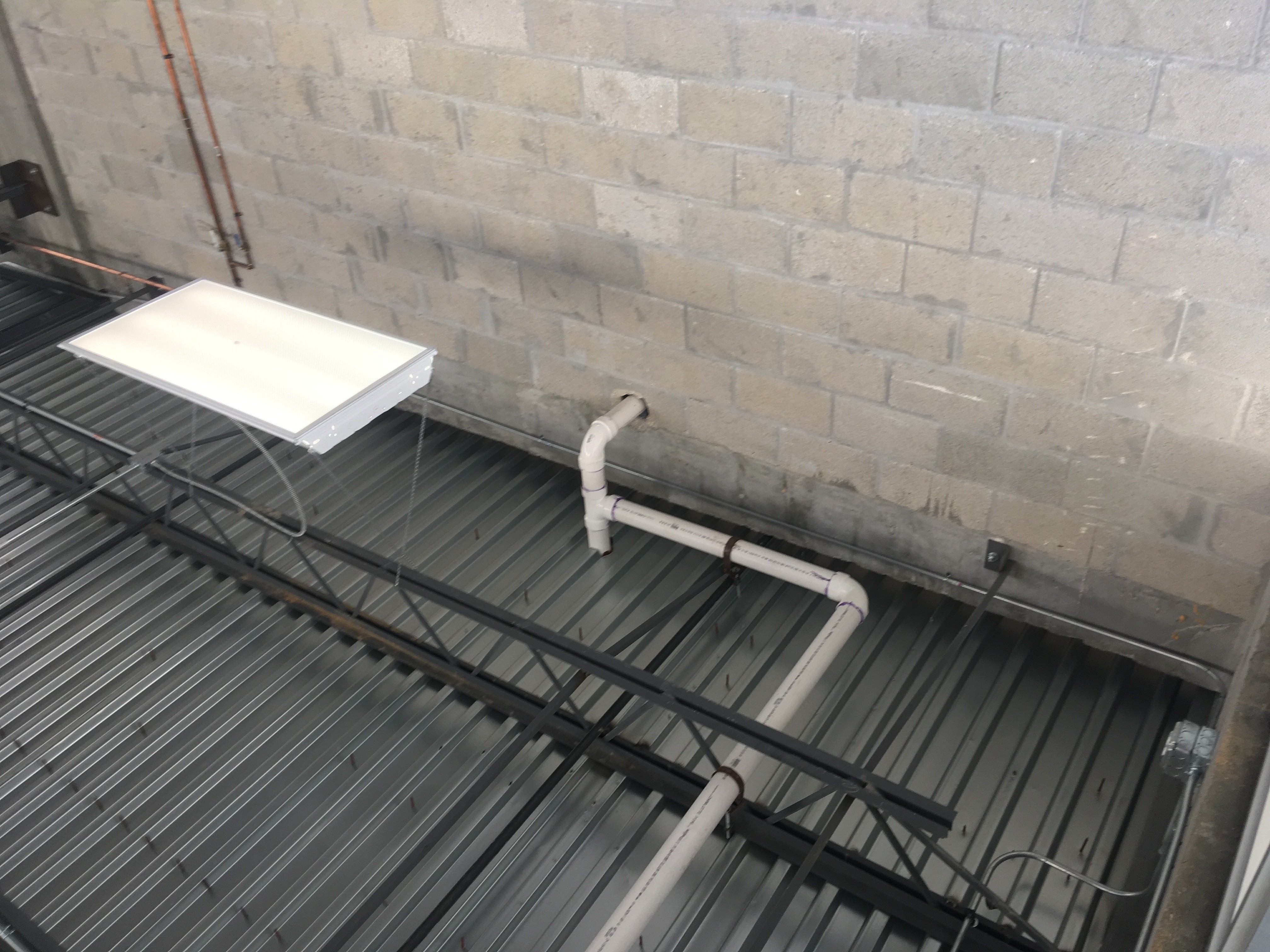 CMU wall with concrete tie Beam to unrated metal deck fire rat...